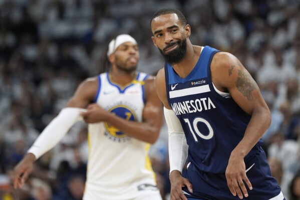 Minnesota Timberwolves guard Mike Conley reacts after Golden State Warriors guard Buddy Hield scores during the first half of Game 5 of an NBA basketball second-round playoff series, Wednesday, May 14, 2025, in Minneapolis. (AP Photo/Abbie Parr)