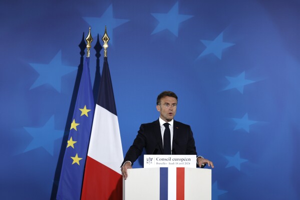 French President Emmanuel Macron speaks during a media conference at an EU summit in Brussels, Thursday, April 18, 2024. European Union leaders on Wednesday debated a new "European Competitiveness Deal" aimed at helping the 27-nation bloc close the gap with Chinese and American rivals amid fears the region's industries will otherwise be left behind for good. (AP Photo/Omar Havana)