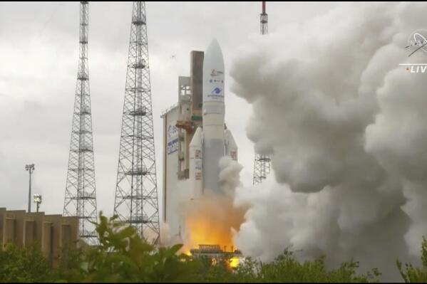 In this image released by NASA, Arianespace's Ariane 5 rocket with NASA's James Webb Space Telescope onboard, lifts off  Saturday, Dec. 25, 2021, at Europe's Spaceport, the Guiana Space Center in Kourou, French Guiana.  The $10 billion infrared observatory is intended as the successor to the aging Hubble Space Telescope.  (NASA via AP)