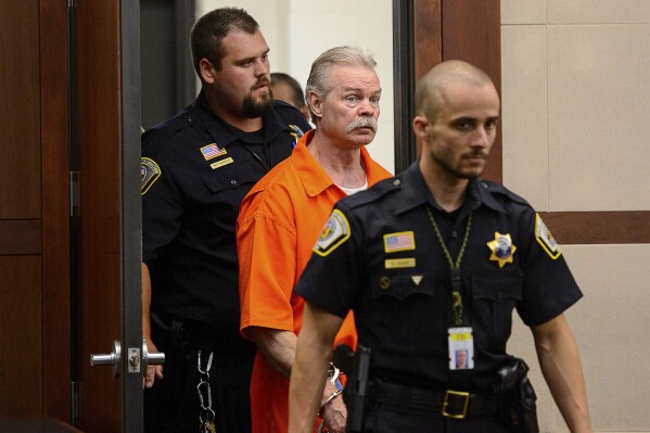 FILE - Douglas Lovell is escorted into the courtroom for an evidentiary hearing, Aug. 5, 2019, in Ogden, Utah. Utah's Supreme Court on Thursday July 25, 2024, overturned Lovell's death sentence but upheld his conviction and sent the case back to a lower court for a new sentencing. Lovell has twice been convicted of capital murder and sentenced to death for the 1985 killing of Joyce Yost. (Trent Nelson/The Salt Lake Tribune via ĢӰԺ, Pool, File)
