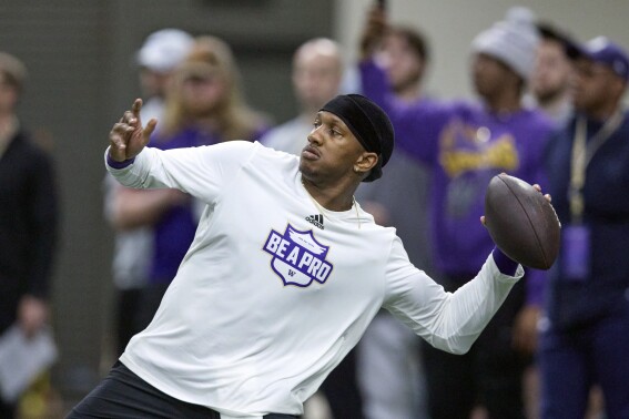Washington quarterback Michael Penix Jr. throws a pass during the NCAA college's NFL football pro day, Thursday, March 28, 2024, in Seattle. (AP Photo/John Froschauer)