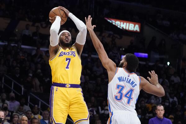 Los Angeles Lakers forward Carmelo Anthony (7) shoots over Oklahoma City Thunder forward Kenrich Williams (34) during the first half of an NBA basketball game Thursday, Nov. 4, 2021, in Los Angeles. (AP Photo/Marcio Jose Sanchez)
