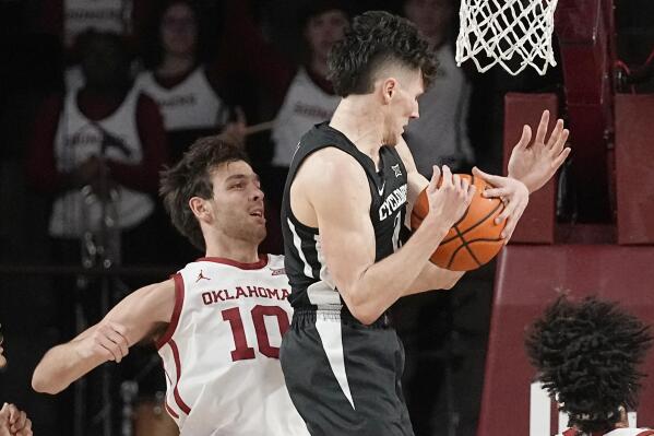 Iowa State guard Caleb Grill, right, grabs a rebound in front of Oklahoma forward Sam Godwin (10) in the first half of an NCAA college basketball game Wednesday, Jan. 4, 2023, in Norman, Okla. (AP Photo/Sue Ogrocki)