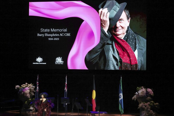 Entertainer Meow Meow performs during the State Memorial Service for Australian comedian and actor Barry Humphries at the Sydney Opera House in Sydney, Friday, Dec. 15, 2023. King Charles III has paid tribute to the late Barry Humphries at a state memorial service with a message that recalled the monarch's own apprehension when the comedian's alter ego Dame Edna Everage played a prank on him in a royal box a decade ago. (David Gray/Pool Photo via AP)