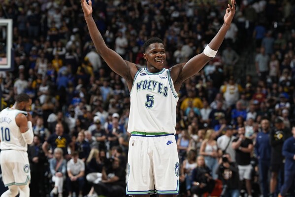 Minnesota Timberwolves guard Anthony Edwards gestures as time runs out in the second half of Game 7 of an NBA second-round playoff series against the Denver Nuggets Sunday, May 19, 2024, in Denver. (AP Photo/David Zalubowski)