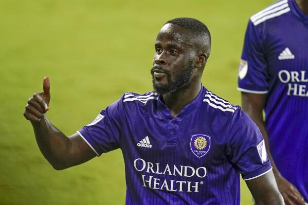 Orlando City forward Benji Michel gives a thumbs-up to fans after scoring a goal against the Chicago Fire during the second half of an MLS soccer match Saturday, Aug. 21, 2021, in Orlando, Fla. (AP Photo/John Raoux)