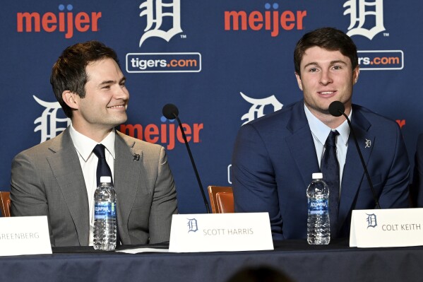 Detroit Tigers president of baseball operations Scott Harris, left, listens as Colt Keith answers a question during a press conference about his contract extension at the MotorCity Casino Hotel Tiger Club in Detroit Tuesday, Jan. 30, 2024. The Detroit Tigers made an unusual bet on a player with no major league experience, agreeing Sunday to a six-year contract with the 22-year-old that guarantees the infield prospect $28,642,500. (Robin Buckson/Detroit News via AP)