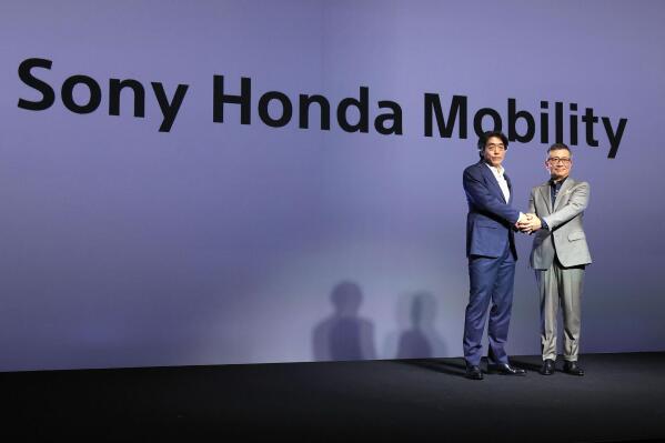 Izumi Kawanishi, left, the Sony executive who became Chief Operating Officer at Sony Mobility and Chief Executive Yasuhide Mizuno pose for a photo during a news conference in Tokyo Thursday, Oct. 13, 2022. A new electric car company that brings together two big names in Japanese business, Honda and Sony, officially kicked off Thursday, with both sides stressing their common values of taking up challenges and serving people’s needs. (Takuto Kaneko/Kyodo News via AP)