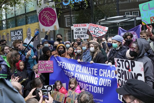 FILE - Climate activist Greta Thunberg demonstrates with others in front of the Standard & Chartered Bank during a climate protest in London, England, October 29, 2021.  AP Photo/Frank Augustine, File)