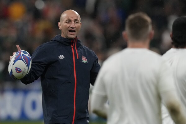 FILE - England's head coach Steve Borthwick directs players during the warm up before the Rugby World Cup semifinal match between England and South Africa at the Stade de France in Saint-Denis, outside Paris, Saturday, Oct. 21, 2023. Borthwick has undertaken a significant revamp of the 36-man squad. There are only 17 survivors from the 34 players used at last year's Rugby World Cup where England finished in third place. (AP Photo/Thibault Camus, File)