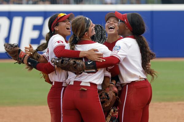 Oklahoma players celebrate a win over Stanford in an NCAA softball Women's College World Series game Monday, June 5, 2023, in Oklahoma City. (AP Photo/Nate Billings)