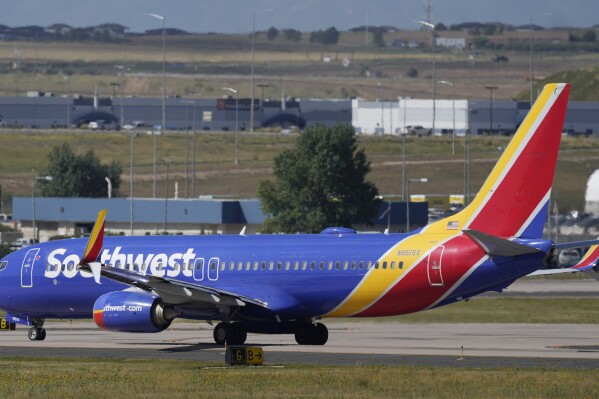 FILE - A Southwest Airlines jetliner waits on a runway for departure from Denver International Airport Friday, Sept. 1, 2023, in Denver. A judge’s order that three attorneys for Southwest Airlines get religious liberty training from a conservative advocacy group was put on hold Friday, June 7, 2024 by a federal appeals court that said the judge likely exceeded his authority with the requirement. (AP Photo/David Zalubowski, File)