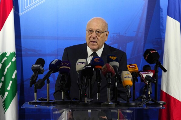 FILE - Lebanese caretaker Prime Minister Najib Mikati speaks during a conference announcing a French reconstruction plan for the Beirut Port, in Beirut, Lebanon, Wednesday, March 13, 2024. Mikati has denied all allegations of money laundering after a complaint was filed in France by two anti-corruption groups this week. The complaint against Najib Mikati was formally filed Tuesday, April 2, 2024, to France’s National Financial Prosecutor’s office by French anti-corruption non-governmental organization Sherpa and the Collective of Victims of Fraudulent and Criminal Practices. (AP Photo/Bilal Hussein, File)