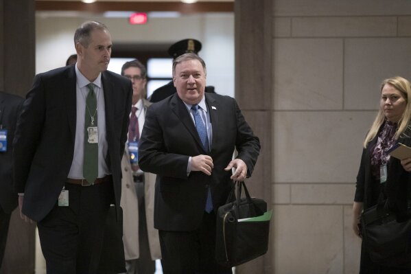 
              Secretary of State Mike Pompeo arrives to give House members a classified security briefing on the murder of Jamal Khashoggi and Saudi Arabia's war in Yemen, on Capitol Hill in Washington, Thursday, Dec. 13, 2018. (AP Photo/J. Scott Applewhite)
            