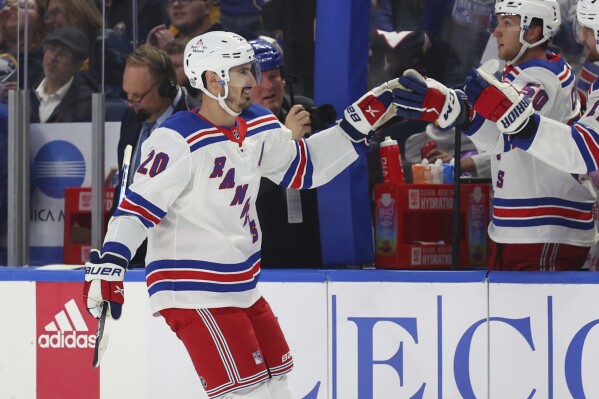 New York Rangers left wing Artemi Panarin (10) looks to pass the puck  during the third period of an NHL hockey game against the Ottawa Senators,  Thursday, March 2, 2023, in New