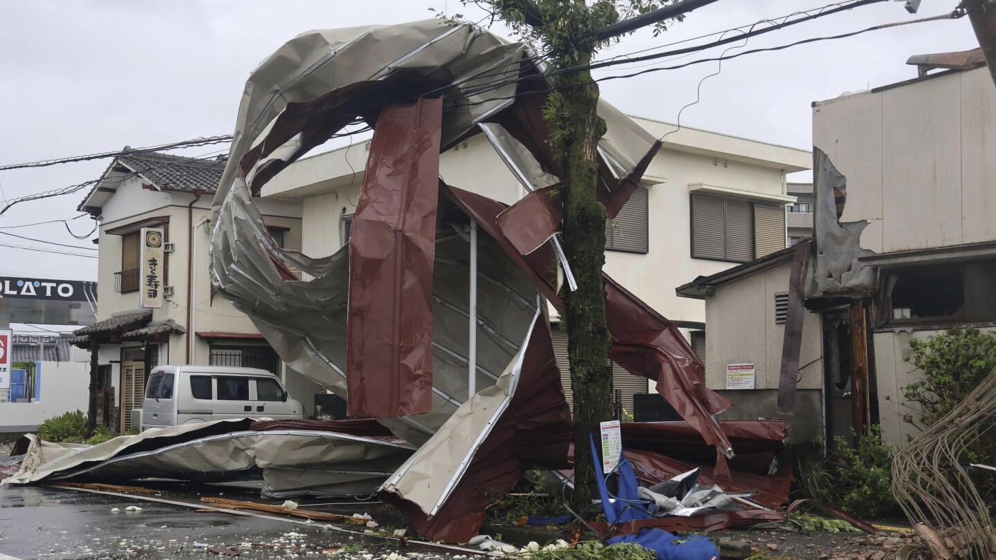 Typhoon lashes Japan with torrential rain and strong winds on a slow crawl north