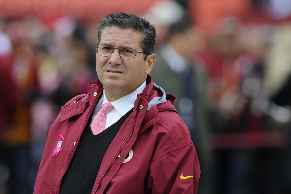 FILE - Washington Redskins owner Daniel Snyder watches his team warm up before an NFL football game against the Atlanta Falcons in Landover, Md., Sunday, Oct. 7, 2012. Snyder sexually harassed a team employee and oversaw team executives who deliberately withheld millions of dollars in revenue from other clubs, and he has agreed to pay a $60 million fine, the league announced Thursday, July 20, 2023. (AP Photo/Richard Lipski, File)