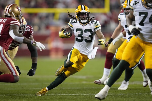 FILE - Green Bay Packers running back Aaron Jones (33) runs the ball during an NFL football game against the San Francisco 49ers Sunday, Jan. 21, 2024, in Inglewood, Calif. The Minnesota Vikings stayed aggressive in free agency Tuesday, March 12, 2024 by adding former Green Bay running back Aaron Jones and 2018 third overall draft pick Sam Darnold as a temporary replacement at quarterback for Kirk Cousins.(AP Photo/Ashley Landis, File)