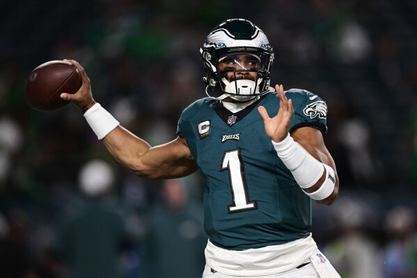 Philadelphia Eagles quarterback Jalen Hurts warms up before an NFL football game against the Minnesota Vikings on Thursday, Sept. 14, 2023, in Philadelphia. (AP Photo/Derik Hamilton)