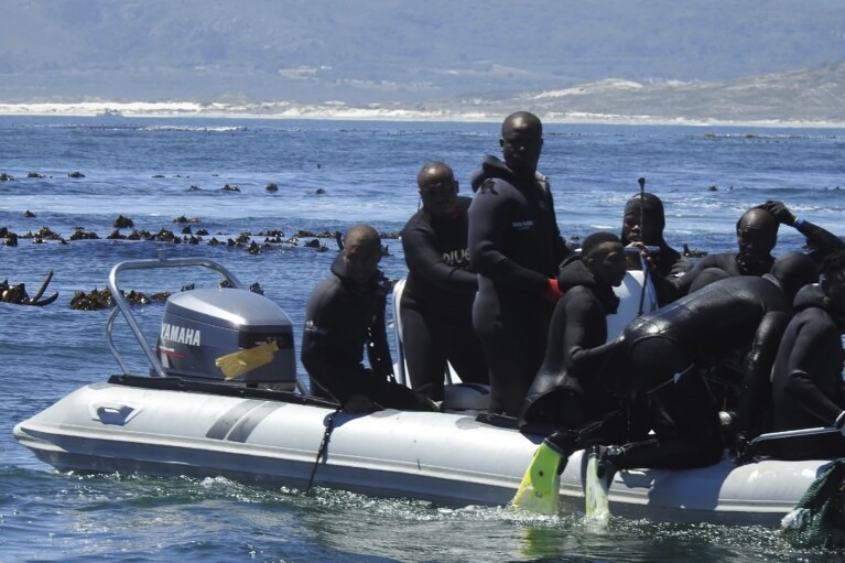 A boat of poachers moves close to Dyer Island off the coast of Gansbaai, South Africa. (Courtesy of Community Against Abalone Poaching via AP)