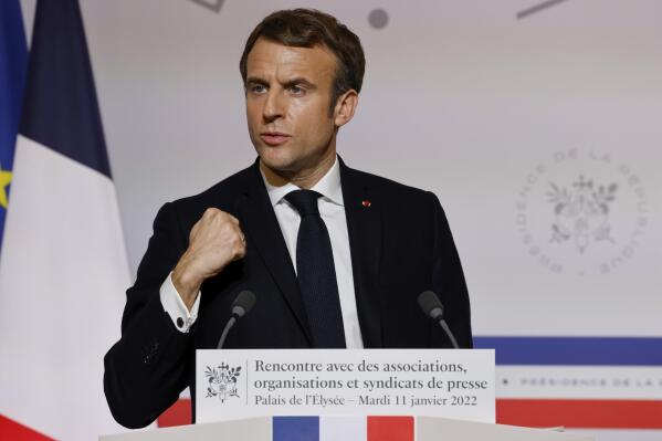 France's President Emmanuel Macron delivers a speech as he adresses his New Year's wishes to media at the Elysee Palace in Paris, France, Tuesday, Jan. 11, 2022. (Ludovic Marin/ Pool via AP)