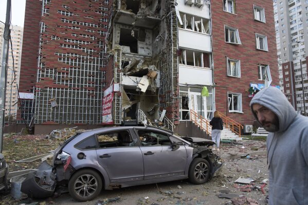 Residents respond near multi-storey buildings damaged by Russian missile and drone attacks in Kiev, Ukraine on Tuesday, June 10th, 2025 (AP Photo/Efrem Lukatsky)