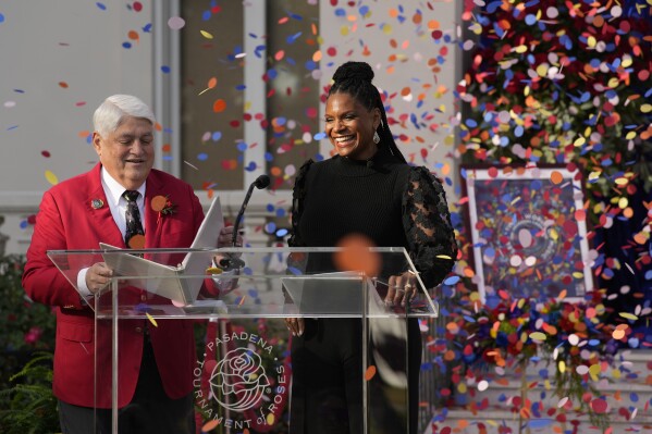 Alex Aghajanian, President and Chairman of the Board for the 2024 Pasadena Tournament of Roses Association, announces actor-singer Audra McDonald as the 2024 Tournament of Roses Grand Marshal, on the front steps of Tournament House in Pasadena, Calif., Friday, Dec. 1, 2023. The 135th Rose Parade presented by Honda, themed "Celebrating a World of Music," and the 110th Rose Bowl Game will be on Monday, Jan. 1, 2024. (AP Photo/Damian Dovarganes)