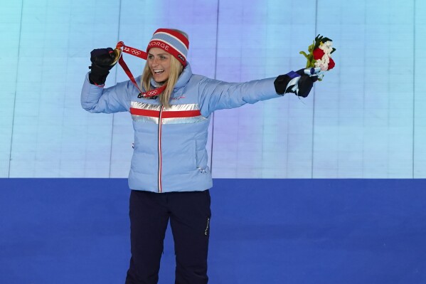 Gold medalist Therese Johaug, of Norway, poses during the medal ceremony for the women's 30km mass start free cross-country skiing at the closing ceremony of the 2022 Winter Olympics, Feb. 20, 2022, in Beijing. (AP Photo/Brynn Anderson, File)