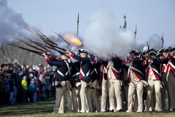 Members of Alpha Company, 3d U.S. Infantry Regiment (The Old Guard), give a firing demonstration on the Bowling Green of George Washington's Mount Vernon on Monday, Feb. 19, 2024, in Mount Vernon, Va. The ceremonies at Mount Vernon were held to honor George Washington's birthday on Feb. 22, and President's Day. (AP Photo/Kevin Wolf)