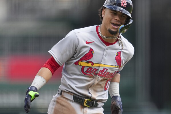 St. Louis Cardinals' Masyn Winn reacts as he rounds the bases after hitting a solo home run during the ninth inning of the first baseball game of a doubleheader against the Cincinnati Reds, Wednesday, April 30, 2025, in Cincinnati. (AP Photo/Jeff Dean)