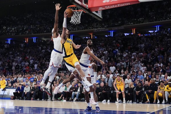 Indiana Pacers guard Andrew Nembhard (2) shoots during the first half of Game 7 in an NBA basketball second-round playoff series against the New York Knicks, Sunday, May 19, 2024, in New York. (AP Photo/Julia Nikhinson)