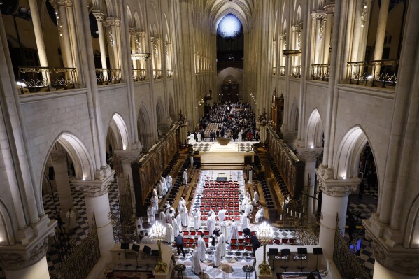Clergy and guests gather inside Notre Dame Cathedral before France's iconic cathedral is formally reopening its doors for the first time since a devastating fire nearly destroyed the 861-year-old landmark in 2019, Saturday Dec.7, 2024 in Paris ( Ludovic Marin, Pool via AP)