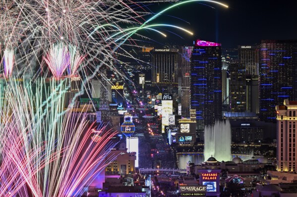 Fireworks explode over the Las Vegas Strip during a New Year's Eve celebration Monday, Jan. 1, 2024, in Las Vegas. (AP Photo/David Becker)