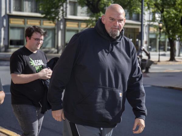 John Fetterman arrives at the Holy Hound Tap Room in downtown York, Pa., Thursday, May. 12, 2022. (Mark Pynes/The Patriot-News via AP)