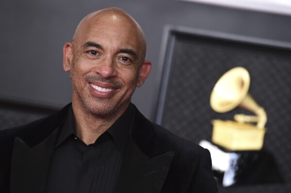 FILE - Harvey Mason jr., CEO of The Recording Academy, appears at the 63rd annual Grammy Awards in Los Angeles on March 14, 2021. In June, the Recording Academy announced a series of changes to the forthcoming Grammy Awards to better reflect an evolving music industry, including new AI protocols. (Photo by Jordan Strauss/Invision/AP, File)