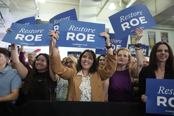 People listen as President Joe Biden speaks about reproductive freedom on Tuesday, April 23, 2024, at Hillsborough Community College in Tampa, Fla. Biden is in Florida planning to assail the state's upcoming six-week abortion ban and similar restrictions nationwide. (AP Photo/Manuel Balce Ceneta)