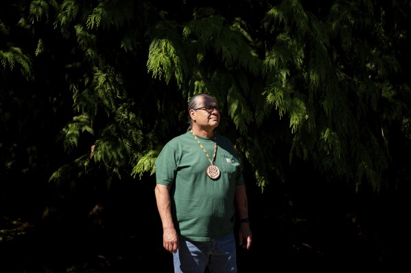 Michael Durglo Jr., climate change advisory committee chairman for the Confederated Salish and Kootenai Tribes in Montana, poses for a portrait at NatureBridge in the Olympic National Park during the 2023 Tribal Climate Camp, Thursday, Aug. 17, 2023, near Port Angeles, Wash.  (AP Photo/Lindsey Wasson)