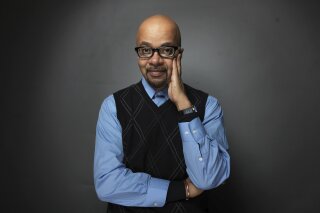 FILE - In this Monday, Jan. 23, 2012, file photo, author and filmmaker James McBride poses for a portrait during the 2012 Sundance Film Festival in Park City, Utah. McBride’s "Deacon King Kong" a fictional snapshot of a Brooklyn neighborhood in the late 1969, has won the inaugural Gotham Book Prize, given for outstanding writing about New York City. (AP Photo/Victoria Will, File)