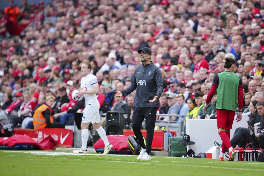 Liverpool's manager Jurgen Klopp, center, gestures during the English Premier League soccer match between Liverpool and Tottenham Hotspur at Anfield Stadium in Liverpool, England, Sunday, May 5, 2024. (AP Photo/Jon Super)
