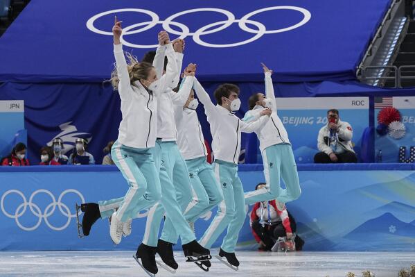 Gold medalists team from the Russian Olympic Committee celebrates following the victory ceremony after the team event in the figure skating competition at the 2022 Winter Olympics, Monday, Feb. 7, 2022, in Beijing. (AP Photo/David J. Phillip)