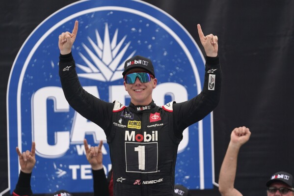 John Hunter Nemechek celebrates winning a NASCAR Xfinity Series auto race at Michigan International Speedway in Brooklyn, Mich., Saturday, Aug. 5, 2023. (AP Photo/Paul Sancya)