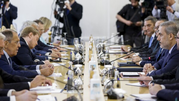 FILE - Russian Foreign Minister Sergey Lavrov, left, meets Turkish Foreign Minister Hakan Fidan, right, in Moscow, Russia, Thursday, Aug. 31, 2023. Russia handed over a list of actions that the West would have to take in order for Ukraine’s Black Sea exports to resume. (Maxim Shemetov/ Pool Photo via AP, File)