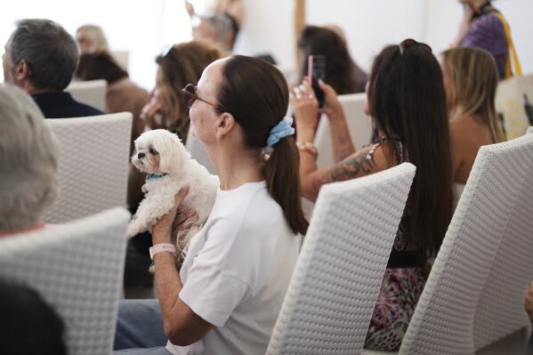 People attend the Palm Dog award ceremony at the 78th international film festival in Cannes, southern France, Friday, May 23, 2025. (AP Photo/Natacha Pisarenko)