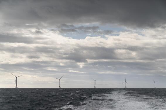 FILE - The five turbines of America's first offshore wind farm, owned by the Danish company, Orsted, are seen from a tour boat off the coast of Block Island, R.I., Oct. 17, 2022. The Biden administration said Wednesday, Feb. 22, 2023, it is considering the first-ever lease sale for offshore wind energy in the Gulf of Mexico, a key part of a push to deploy 30 gigawatts of offshore wind by 2030 to help fight climate change. (AP Photo/David Goldman, File)