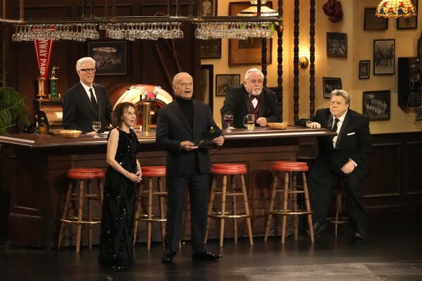 Rhea Perlman, from left, Kelsey Grammar, Ted Danson, John Ratzenberger, George Wendt present the award for outstanding writing for a comedy series during the 75th Primetime Emmy Awards on Monday, Jan. 15, 2024, at the Peacock Theater in Los Angeles. (AP Photo/Chris Pizzello, file)