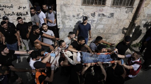 Palestinians carry the body of a man killed during an Israeli military raid in the West Bank city of Nablus, Friday, July 7, 2023. The Palestinian Health Ministry said two men were killed by Israeli fire. The deaths are part of a year-long spiral of violence that shows no signs of abating. (AP Photo/Majdi Mohammed)