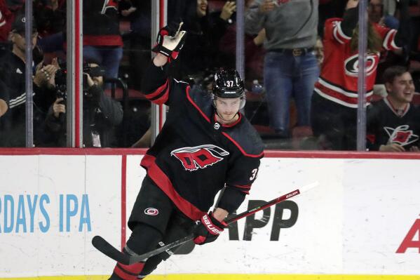 Carolina Hurricanes right wing Andrei Svechnikov (37) celebrates after he put the puck past Washington Capitals goaltender Darcy Kuemper during the shootout period of an NHL hockey game Monday, Oct. 31, 2022, in Raleigh, N.C. It proved to be the winning goal. (AP Photo/Chris Seward)