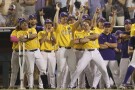LSU's Brayden Jobert (6) is greeted after his 2-run homer in the 9th inning of Game 3 of the NCAA College World Series baseball finals against Florida in Omaha, Neb., Monday, June 26, 2023. (AP Photo/Rebecca S. Gratz)