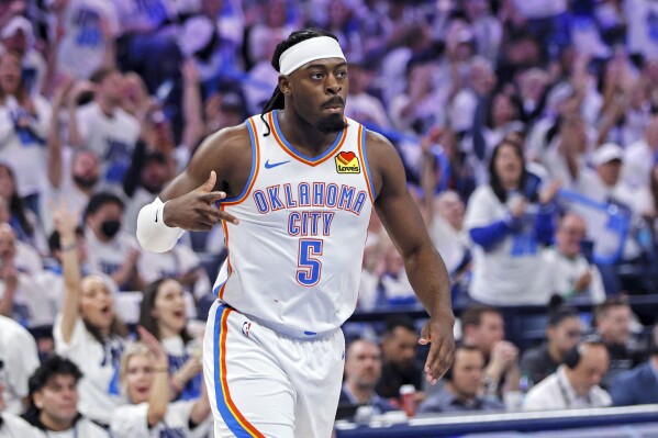 Oklahoma City Thunder guard Luguentz Dort gestures after making a 3-point basket during the first half in Game 1 of an NBA first-round playoff series against the Memphis Grizzlies, Sunday, April 20, 2025, in Oklahoma City. (AP Photo/Nate Billings)