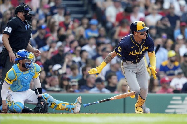 Milwaukee Brewers' Joey Ortiz runs on his two-run double in front of Boston Red Sox catcher Connor Wong during the third inning of a baseball game, Saturday, May 25, 2024, in Boston. (AP Photo/Michael Dwyer)